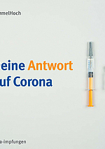 Eine Spritze mit COVID-19-Impfstoff liegen beieinander.